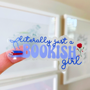 Sticker with 'literally just a bookish girl' text held by a hand.
